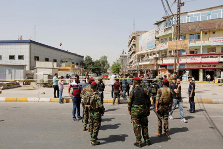 Lực lượng an ninh Iraq có mặt tại hiện trường vụ nổ bom ở Jadida, Baghdad hôm 27/9.